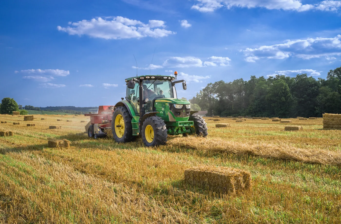 Tractor using GPS guidance across a field